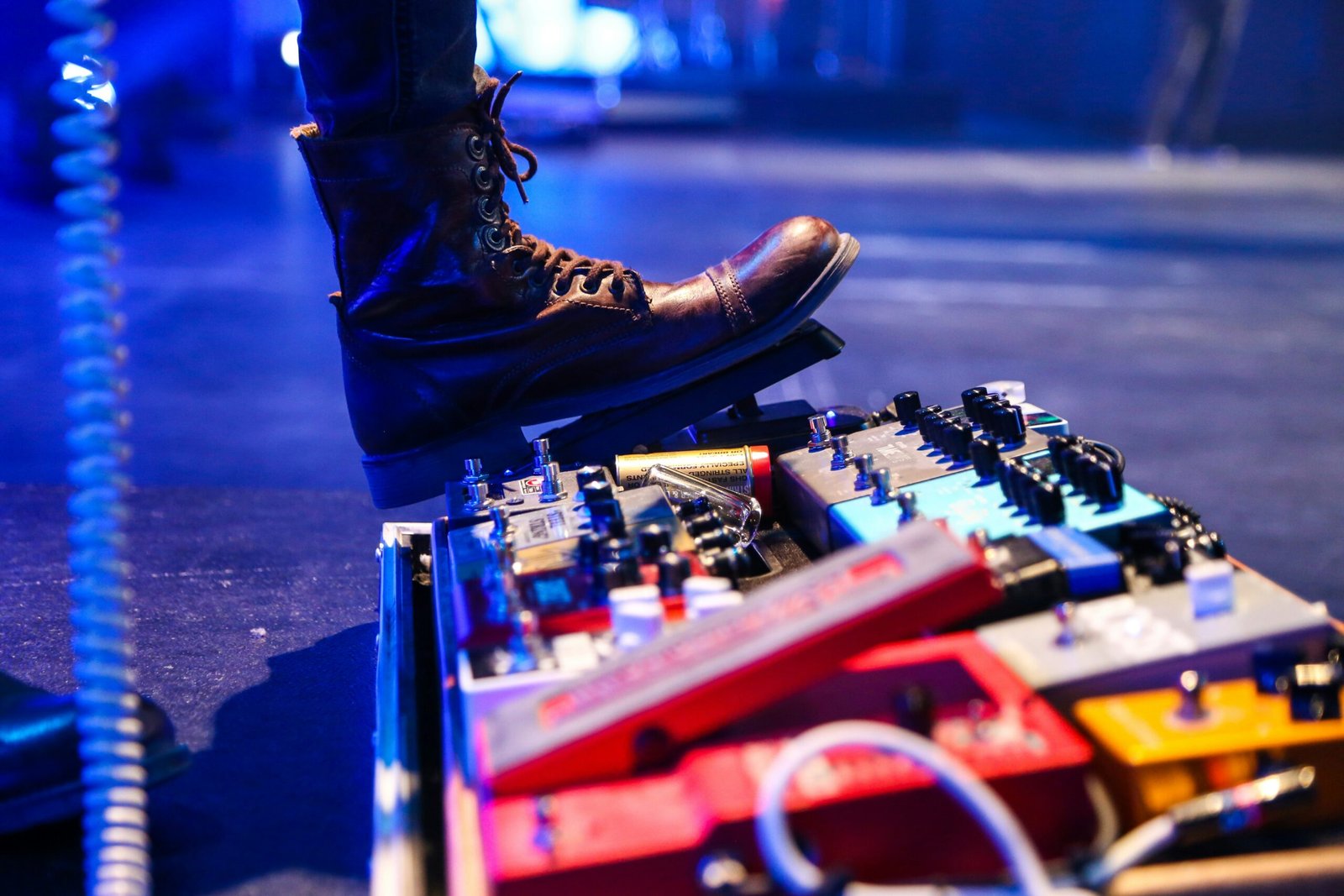 person stepping on guitar pad